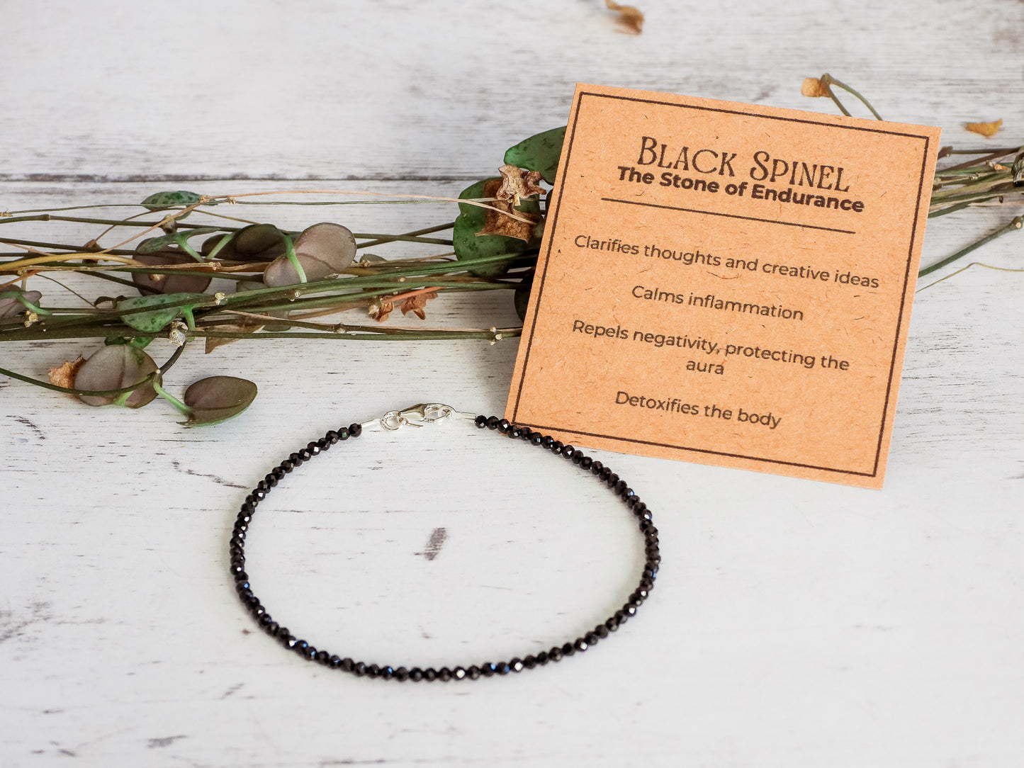 black spinel crystal healing bracelet with card