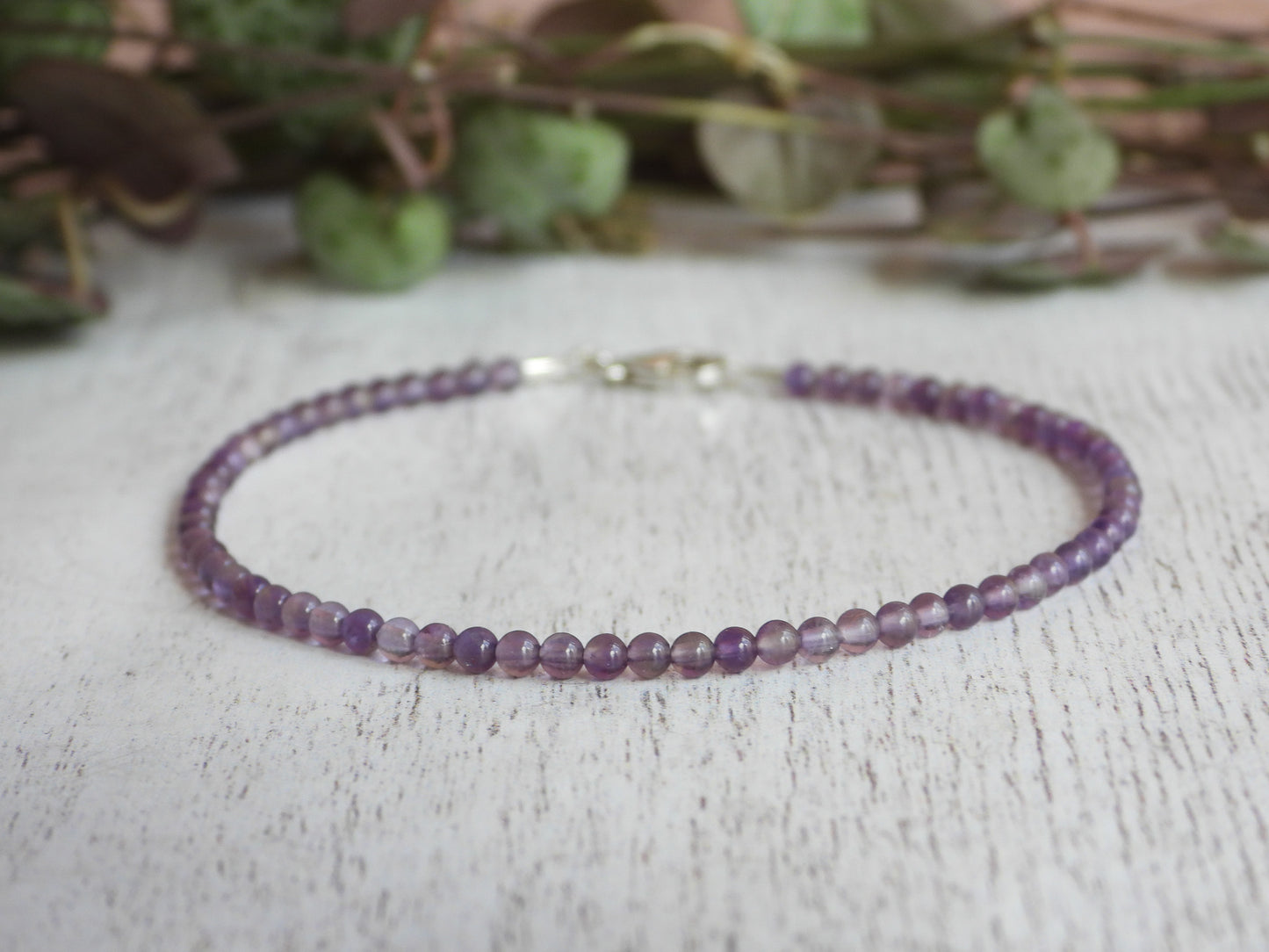 minimalist February birthstone bracelet featuring 2mm amethyst gemstone beads