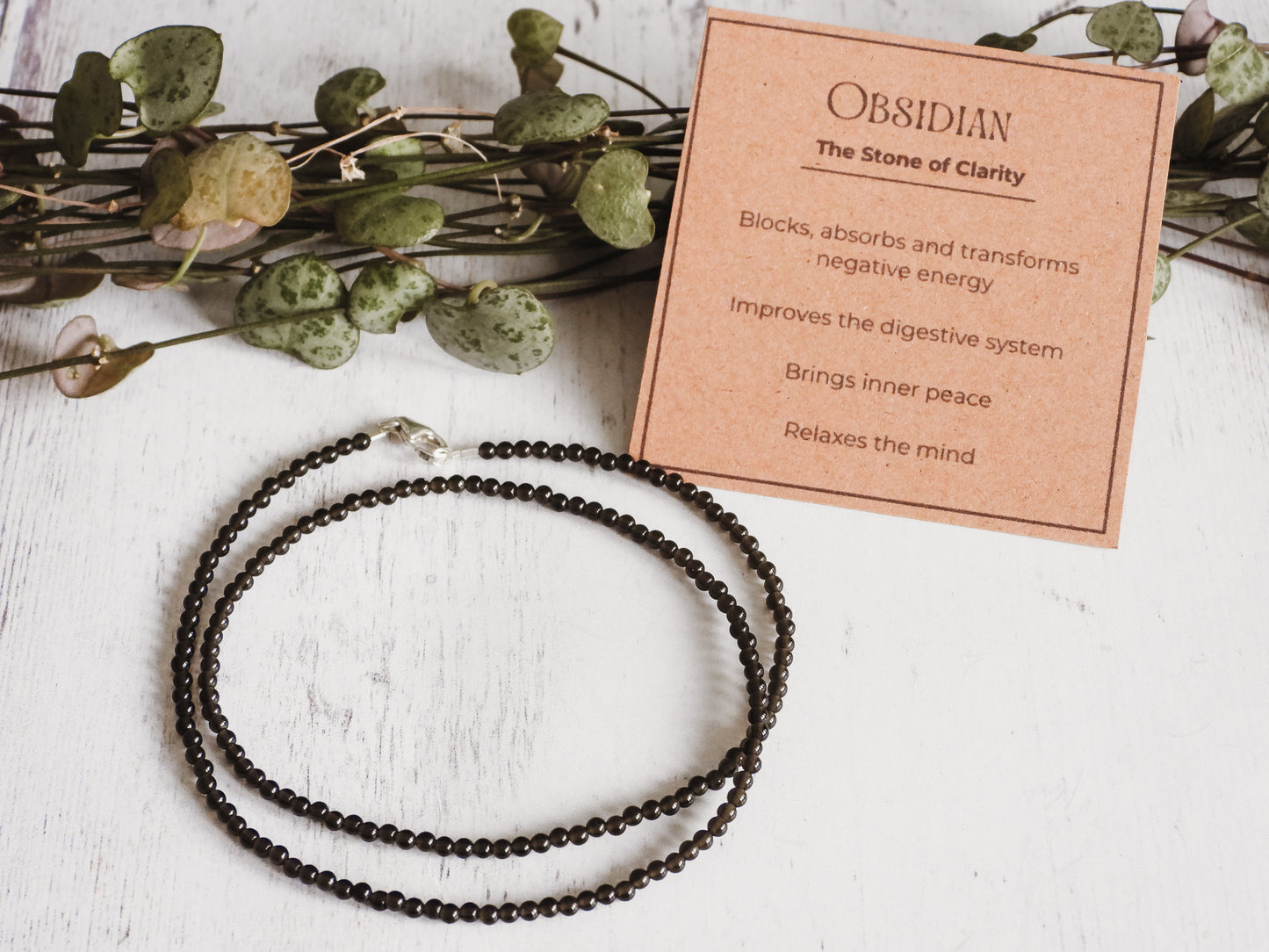 black obsidian necklace with crystal healing properties card