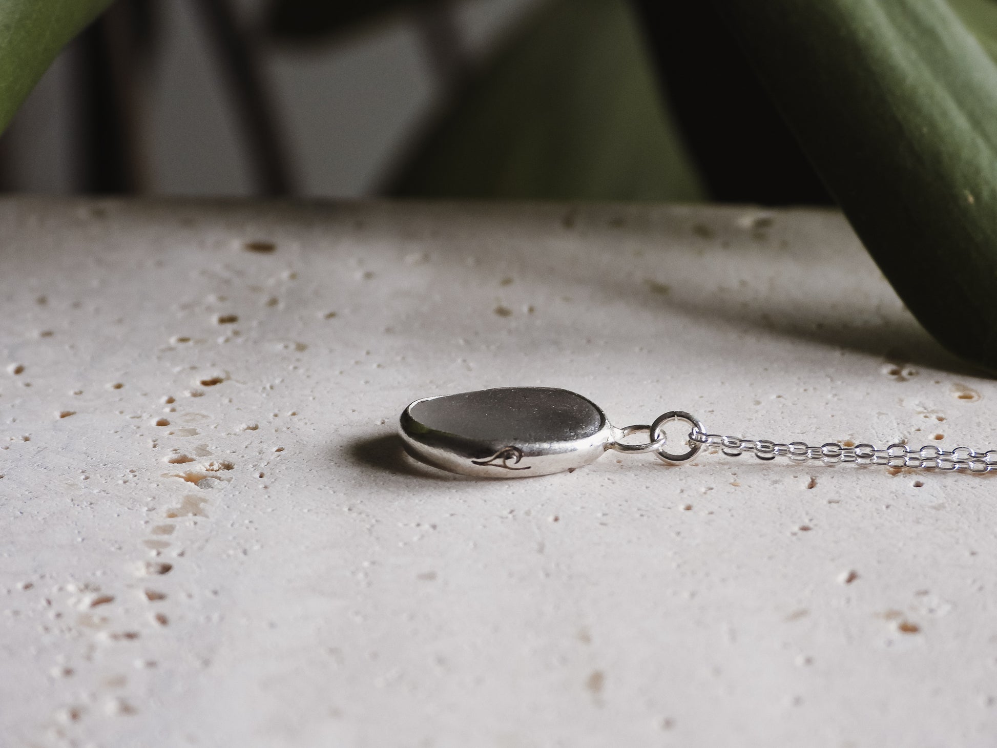 wave stamp on cornish grey seaglass necklace