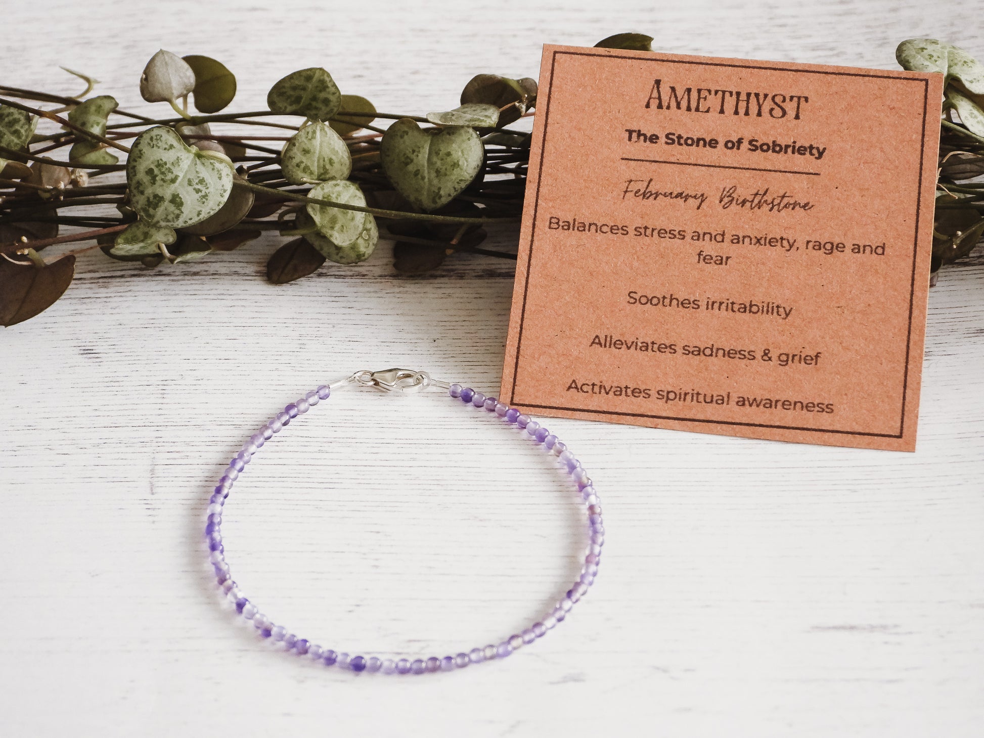 purple amethyst gemstone bracelet with crystal healing properties card