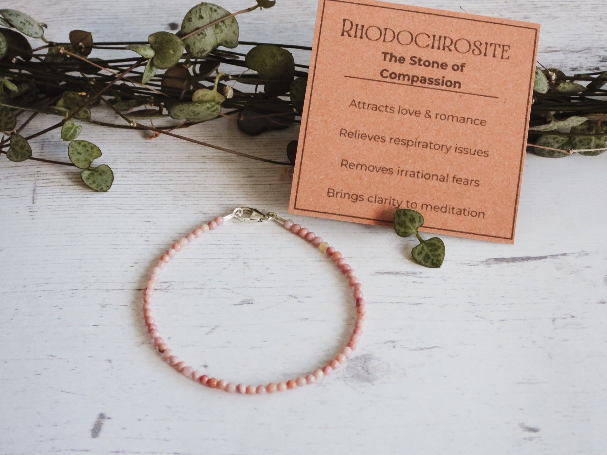 rhodochrosite pink gemstone bracelet with healing properties card