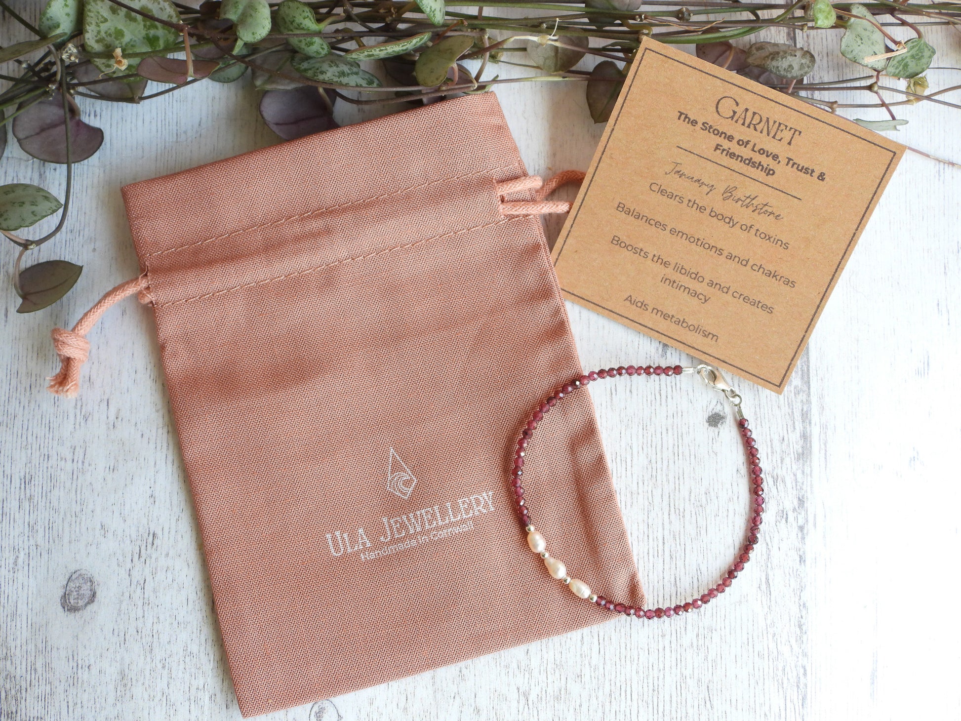 handmade garnet and pearl birthstone bracelet with crystal healing properties card