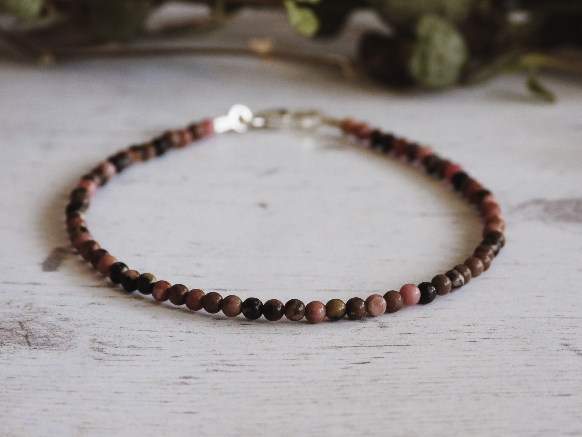 minimalist rhodonite crystal healing bracelet with sterling silver clasp