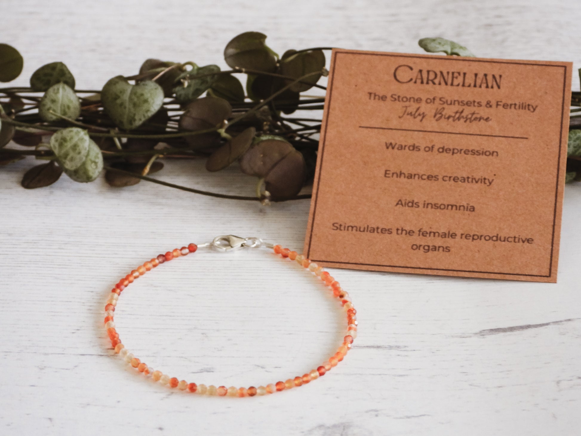orange minimalist July birthstone beaded bracelet
