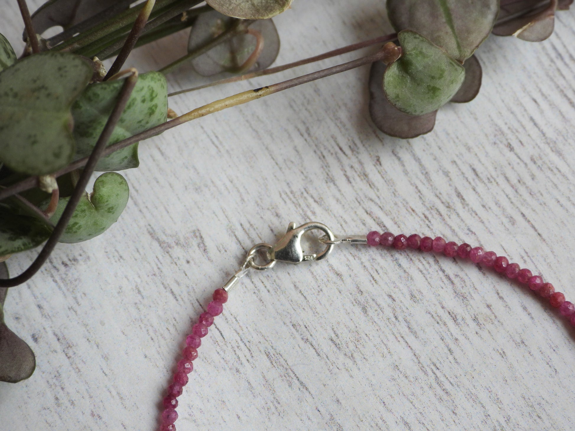 dainty ruby gemstone birthstone bracelet with sterling silver clasp in boho style