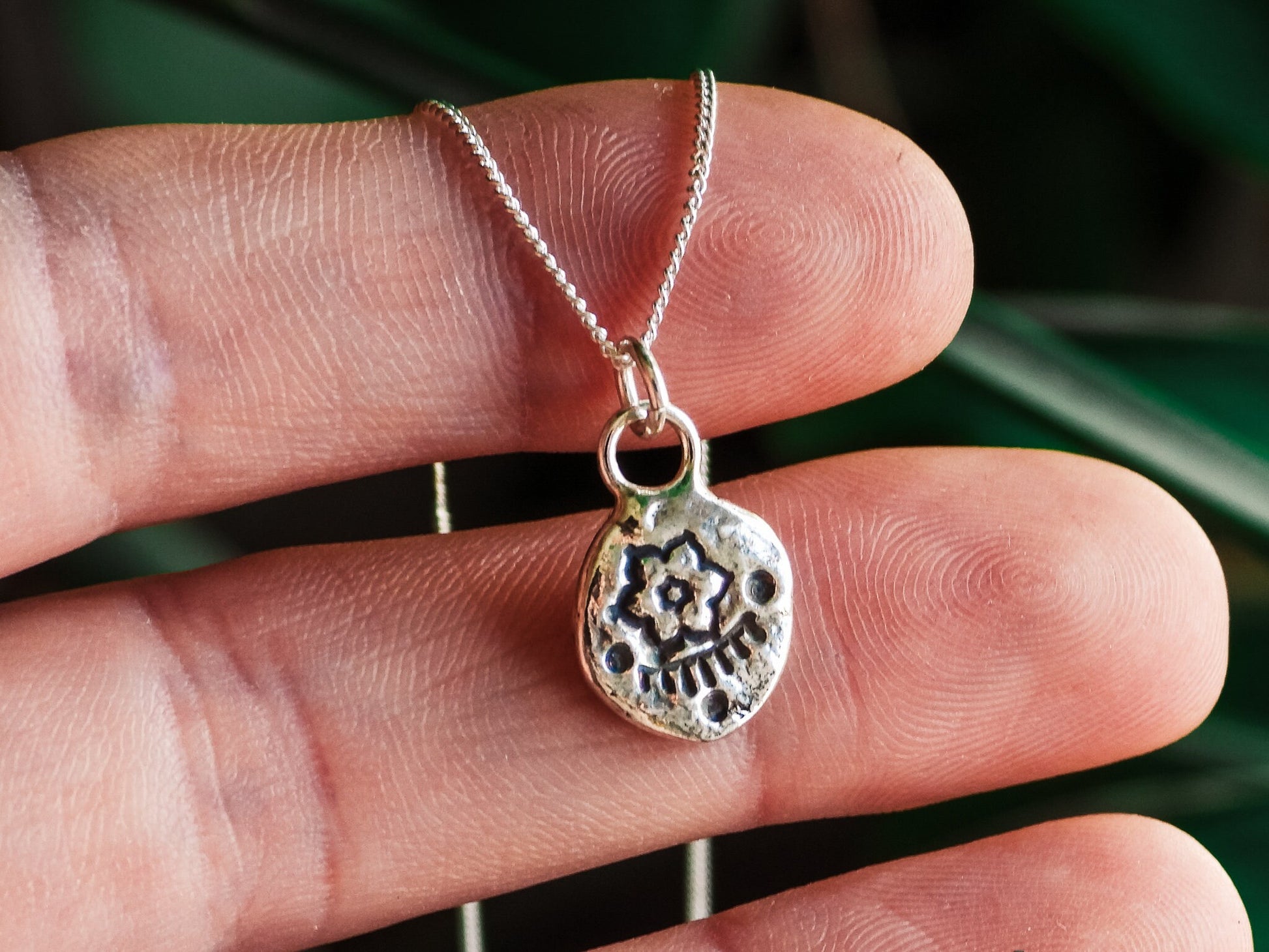 dainty flower pendant necklace made with recycled silver 